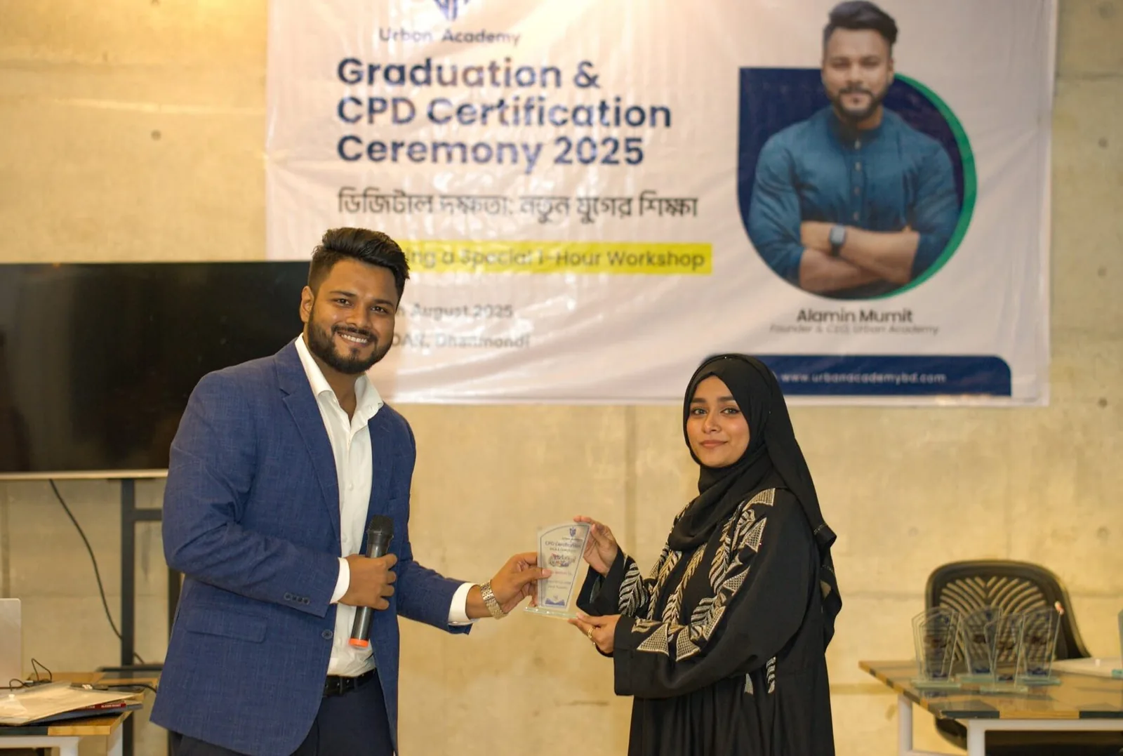 A graduate receiving a certificate on stage
